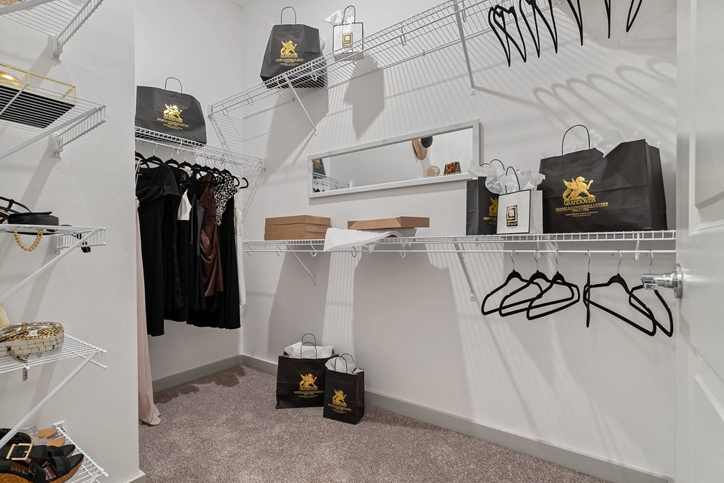 a closet with white walls and shelves with bags and shoes
