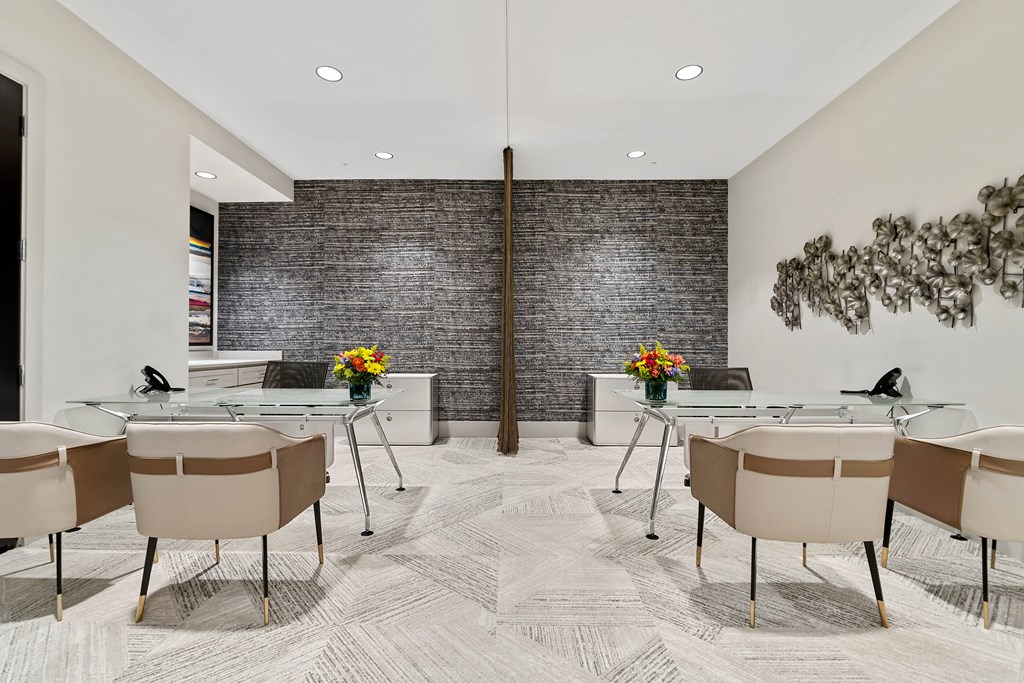 a conference room with glass tables and chairs