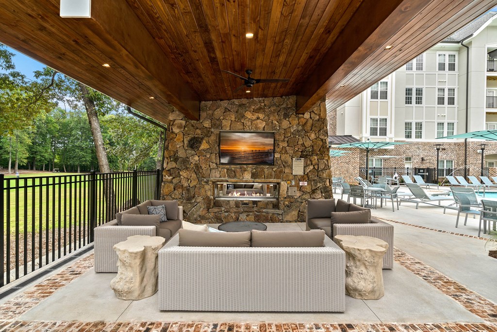 the preserve at ballantyne commons clubhouse with couches and a fireplace