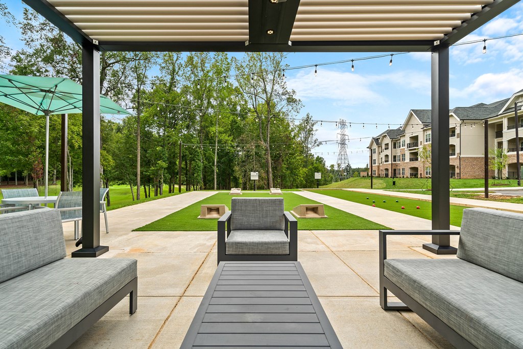 a lounge area with couches and a coffee table on a patio