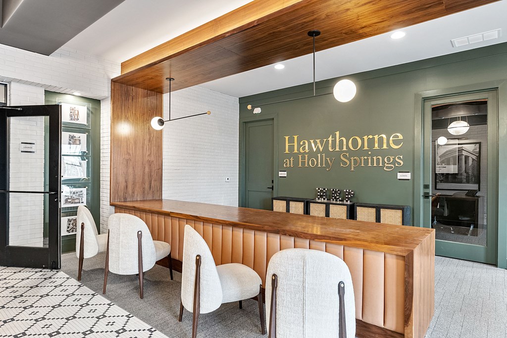 a tasting room with a wooden bar and chairs