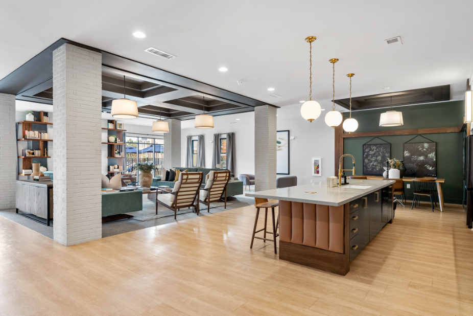a communal area with a kitchen and dining area and a living room