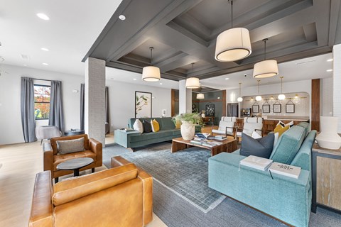 a living room with couches and chairs and a table