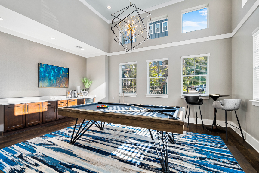 a game room with a ping pong table and a bar