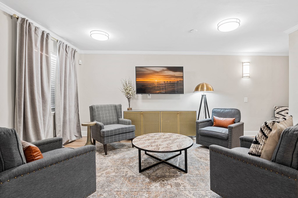 a living room with couches and chairs and a coffee table