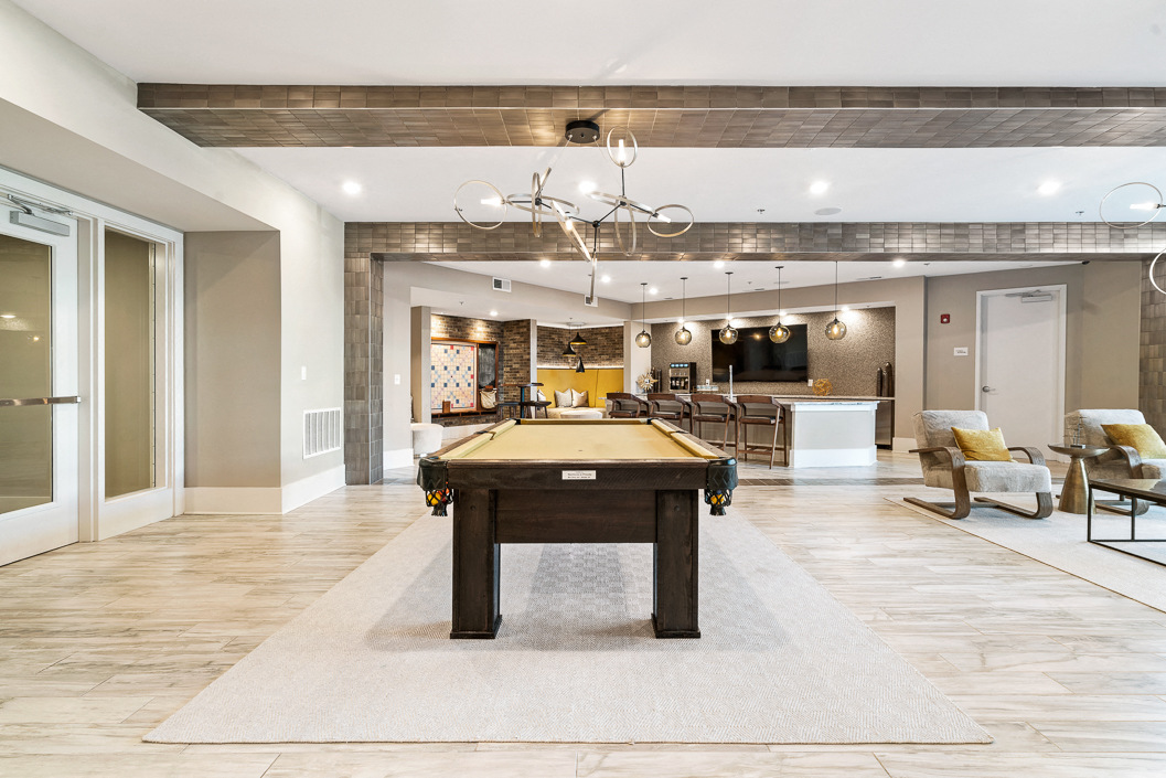 Pool table in resident clubhouse at hawthorne at friendly apartments