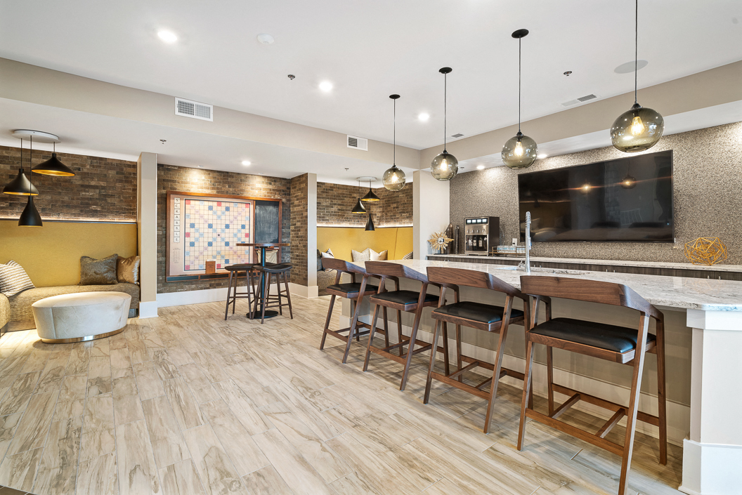 Stylish resident lounge with demo kitchen and large scrabble board Hawthorne at Friendly Greensboro NC