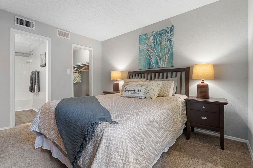 a bedroom with a bed and a closet