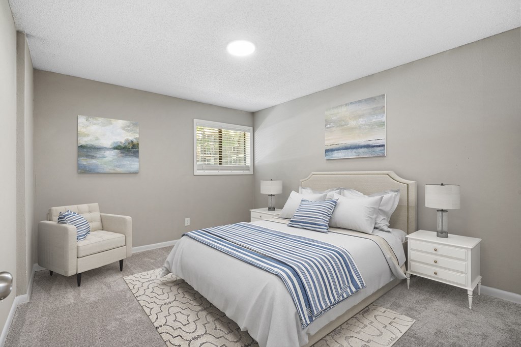 a bedroom with a bed and a chair