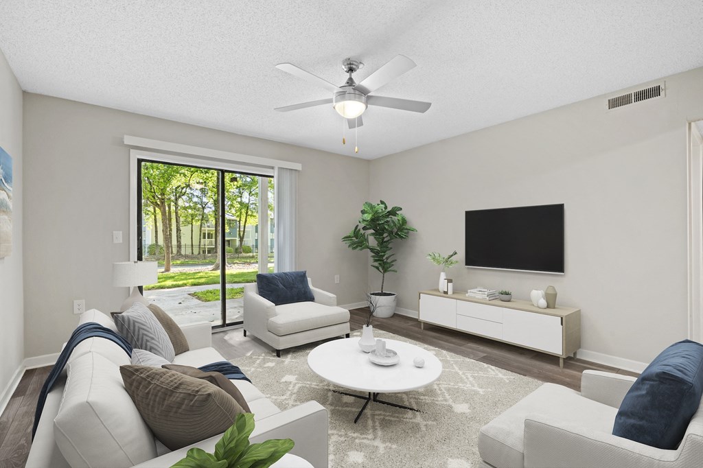 a living room with couches and a coffee table