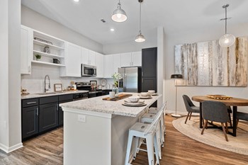 Kitchen with Spacious Breakfast Bar at the Newton Apartments in Charlotte, NC Kitchen with Spacious Breakfast Bar at the Newton Apartments in Charlotte, NC - Photo Gallery 5