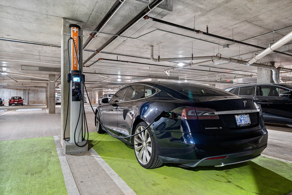 a car parked at a gas station in a parking garage