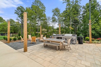 Outdoor Firepit and Grilling Station at The Newton Apartments in Charlotte, NC