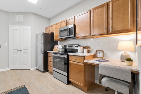 Home Interior our apartments offer a kitchen with stainless steel appliances and wooden cabinets