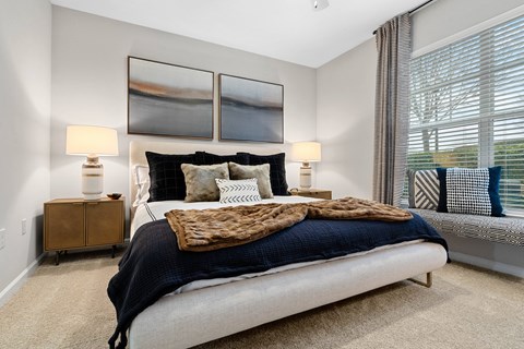 Home Interior Highlight Spacious Bedroom with Large Windows and Ceiling Fan