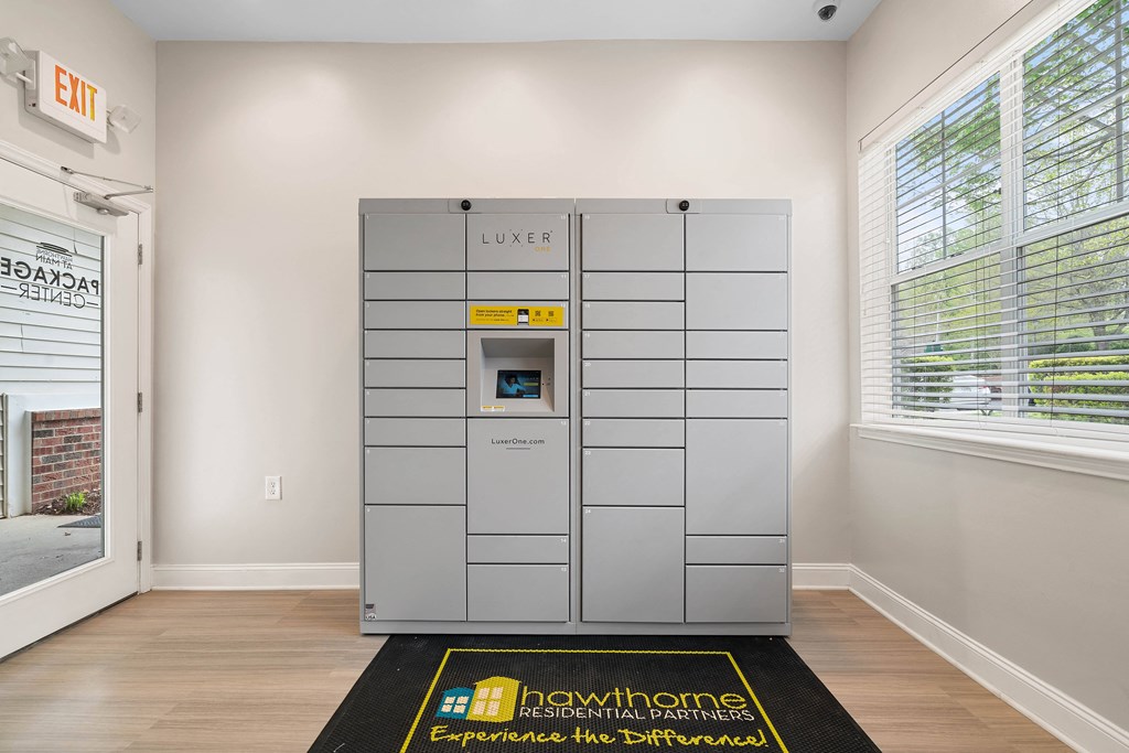 a vending machine in the corner of a room with two windows