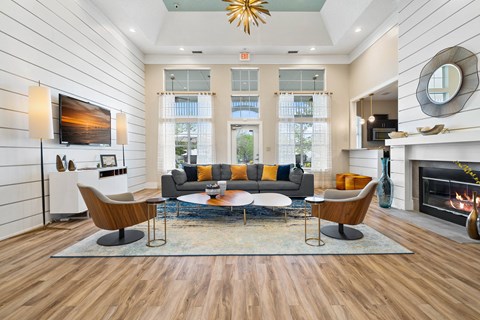 a living room with a couch and a table and a fireplace