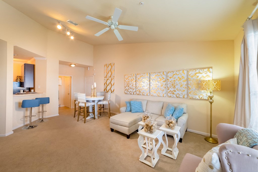 a living room and dining room with a couch and a table