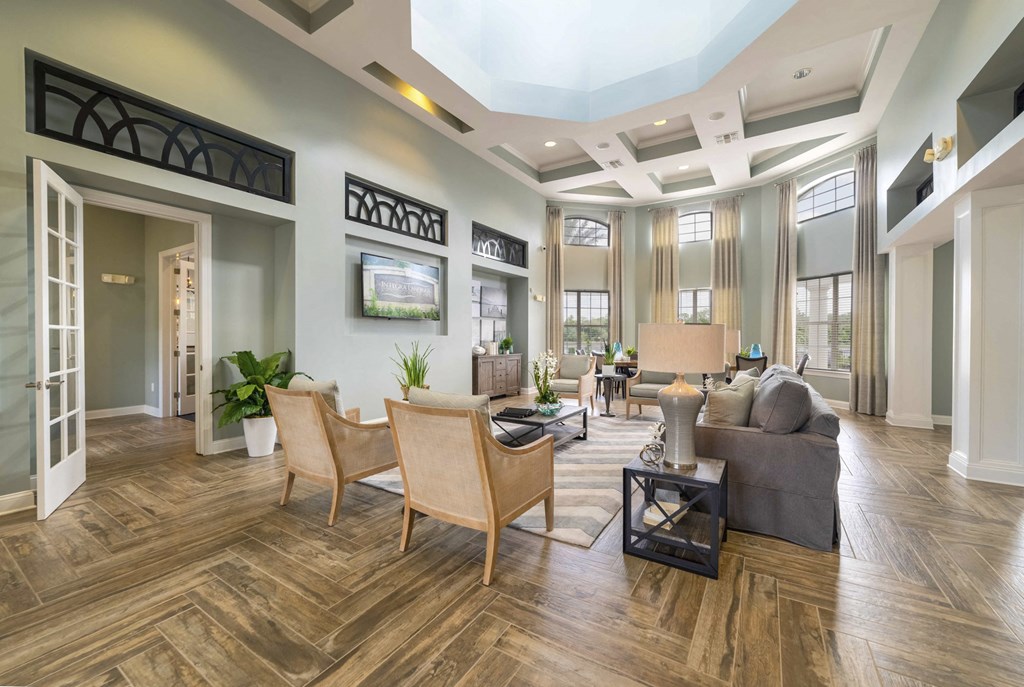 a living room with a couch and chairs