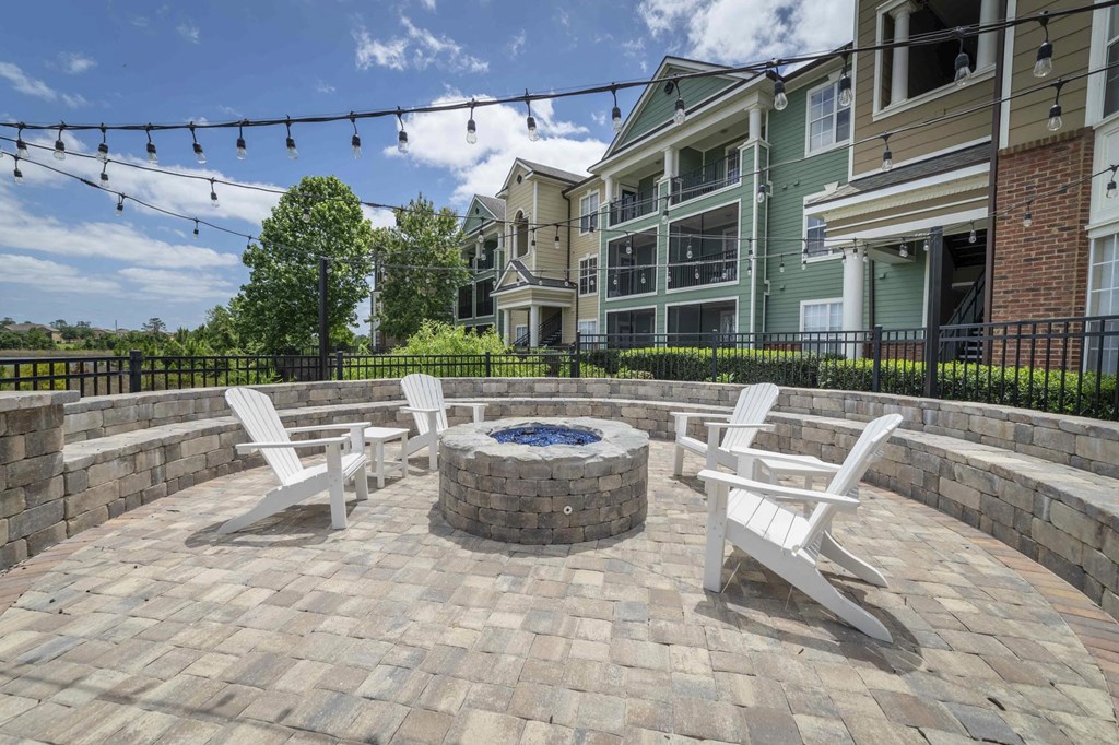 a group of white chairs sitting in front of a building