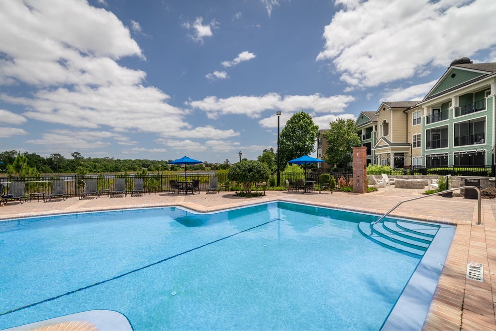 a swimming pool with a building in the background