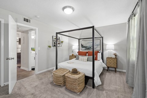 a bedroom with a large bed and a white closet