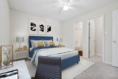 a bedroom with a bed and a ceiling fan