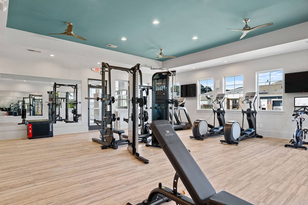 Amenities Highlight Fitness Center Equipped with Cardio Equipment, and Free Weights