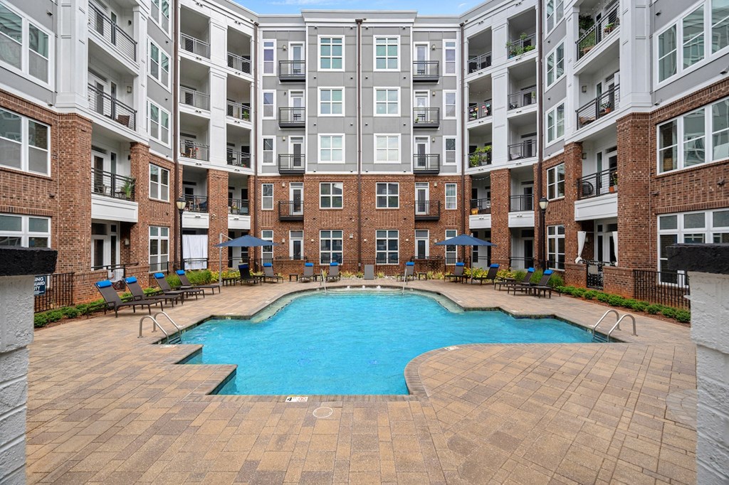 Amenities Highlight Community Courtyard with Sparkling Swimming Pool