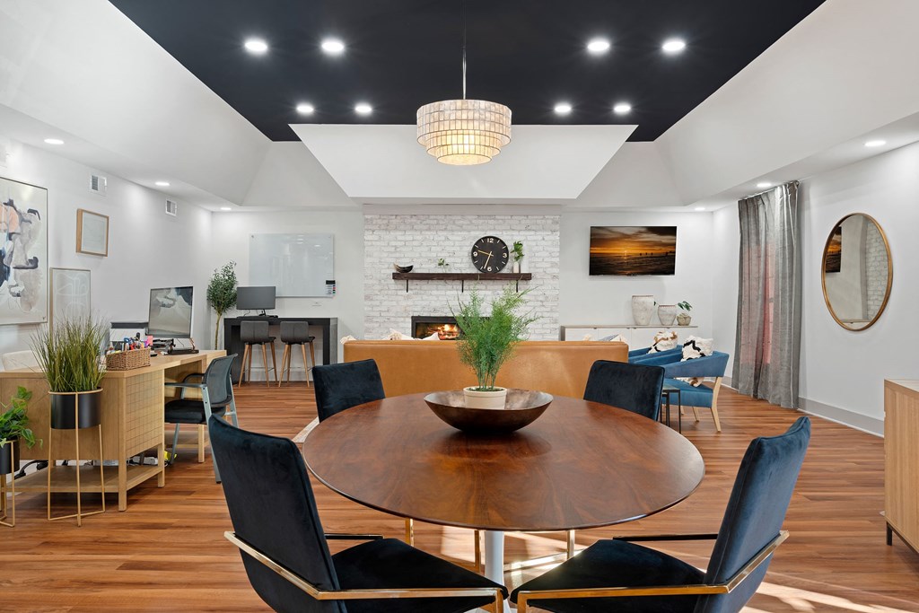 a dining room with a wooden table and chairs