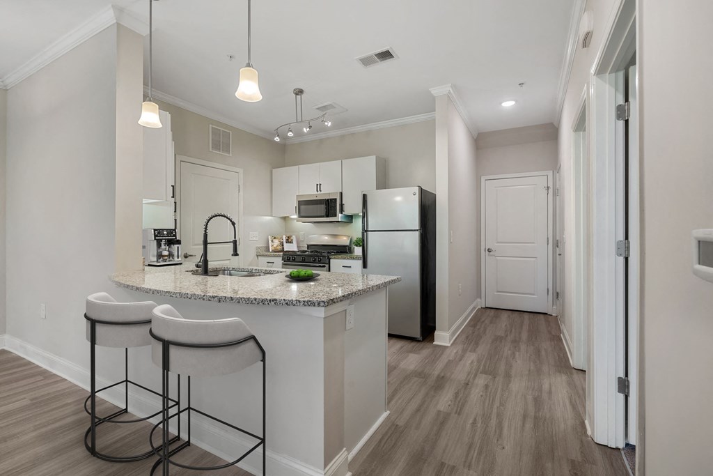 a kitchen with a counter top and a refrigerator