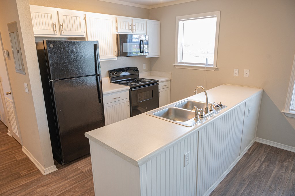 Spacious kitchen in your new home at Deerbrook Apartments in Wilmington, NC 28405
