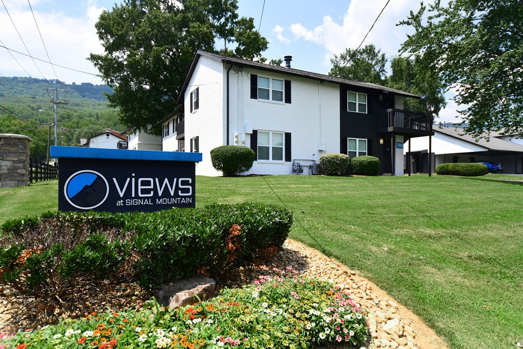 an image of the views apartments sign in front of the building