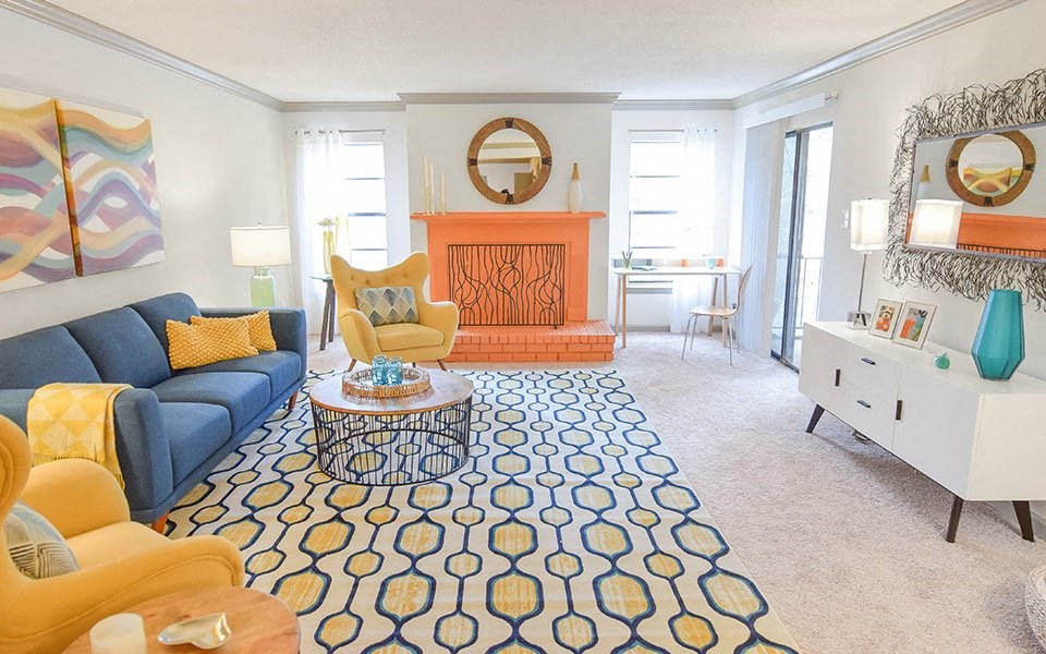 a living room with a couch and a fire place