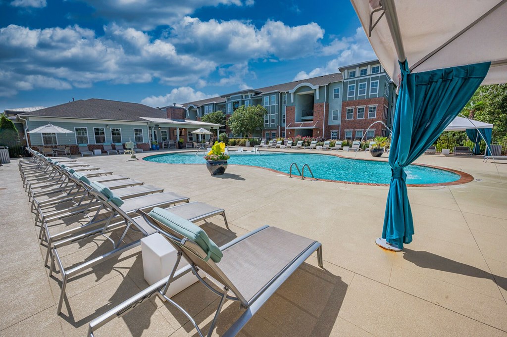 our apartments have a large pool and lounge chairs