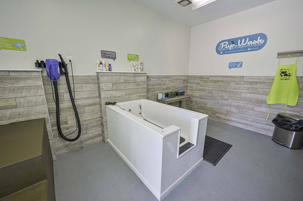 a wet room with a tub and a shower in it