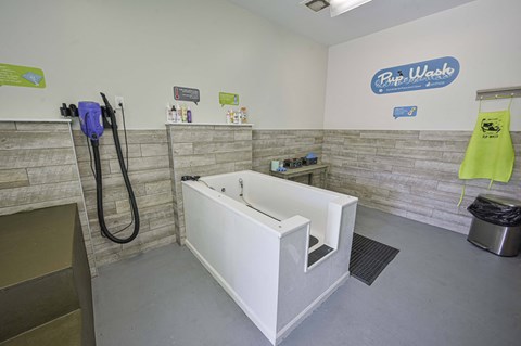 a wet room with a tub and a shower in it