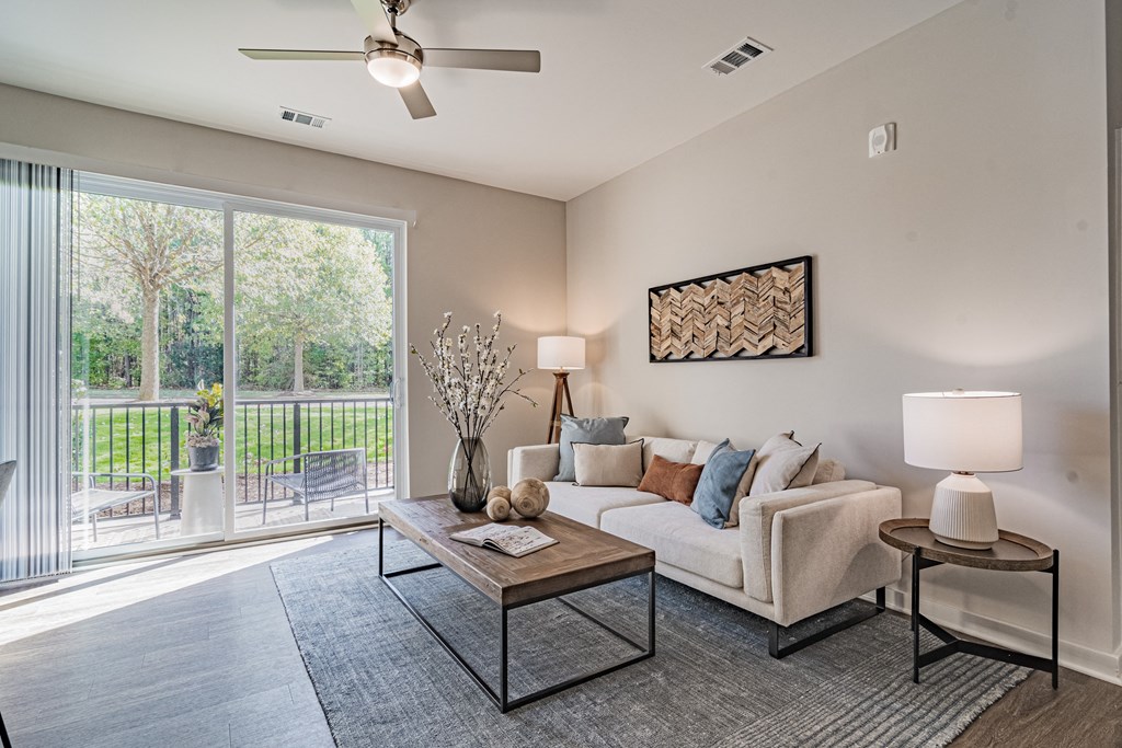 an open living room with a couch and a coffee table