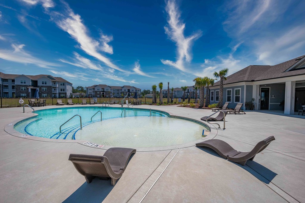 our apartments have a large pool and lounge chairs