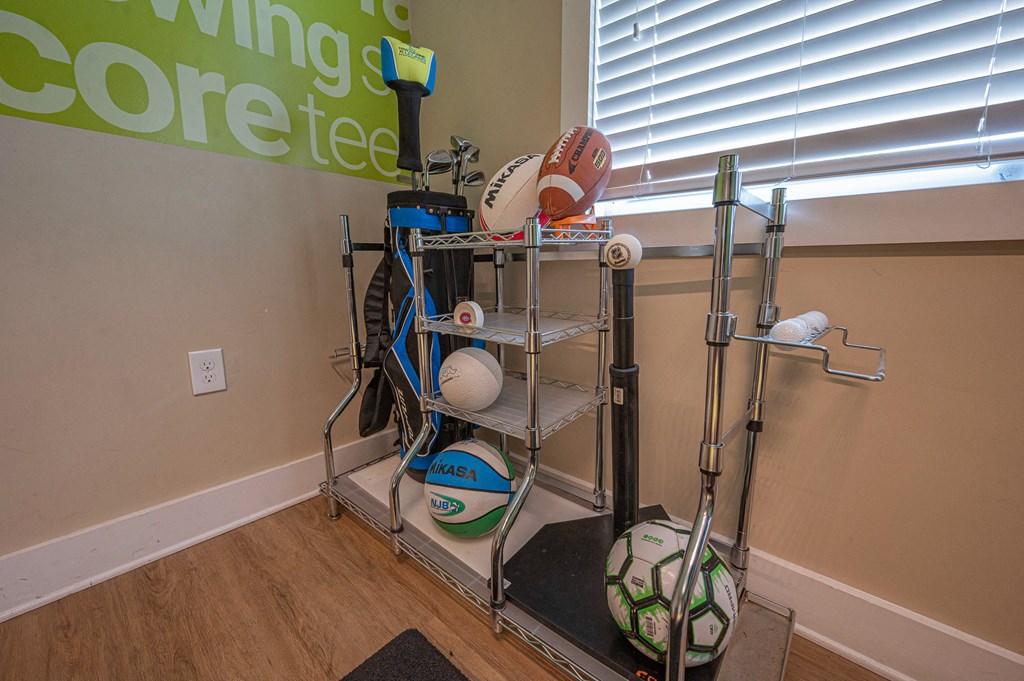 a shelving unit with various items on it in a room