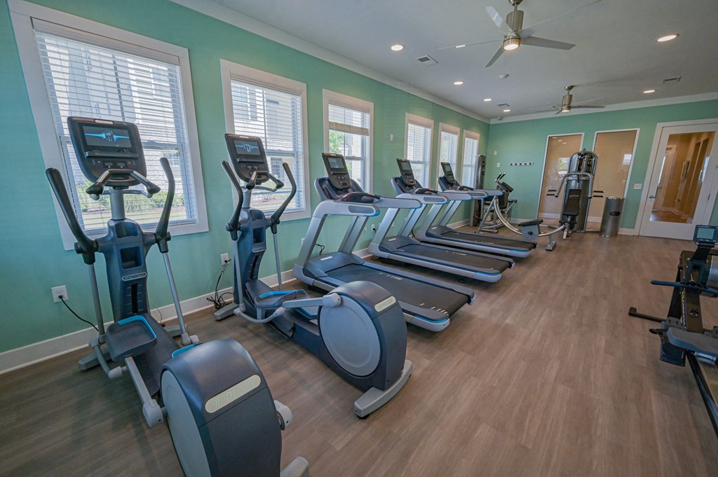 a gym with cardio equipment and exercise machines