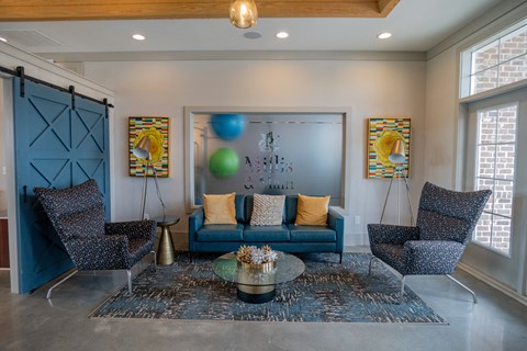 Relax with friends and family inside the clubhouse at Millis and Main at Grandover