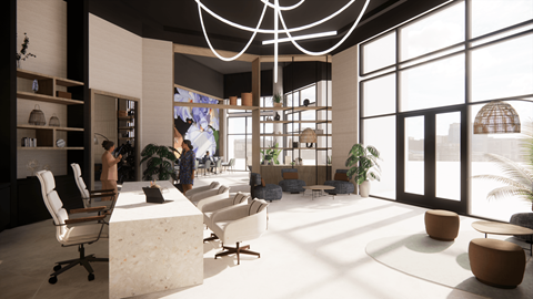A modern office space with a reception desk, chairs, and a large window.