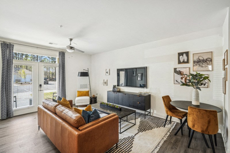 a living room with a couch and a table and a television