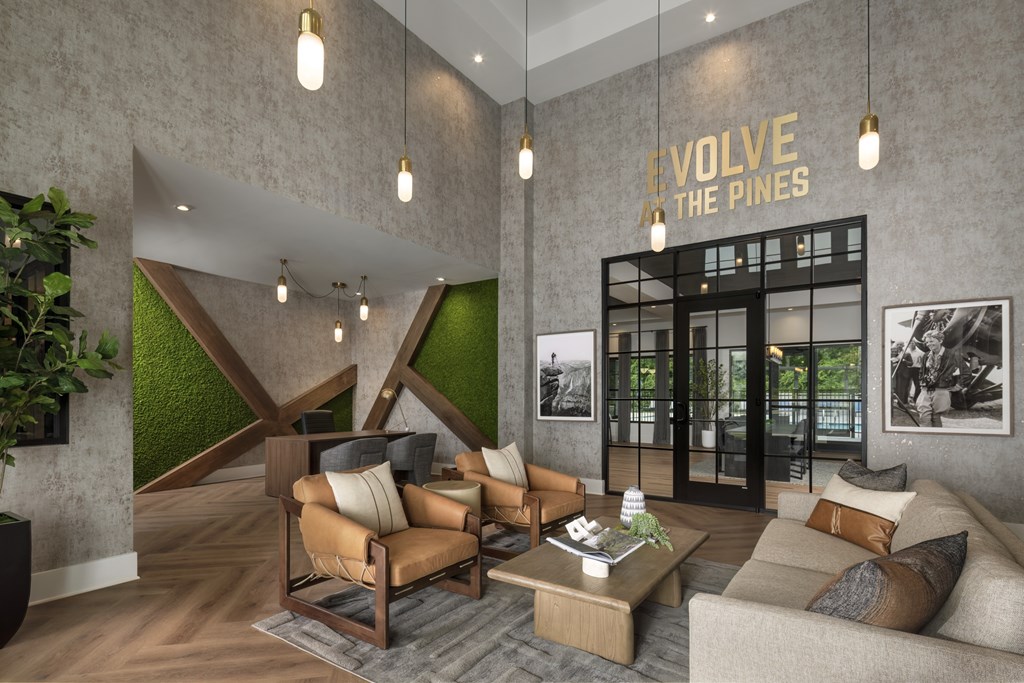 A modern living room with a green accent wall and a sign that reads