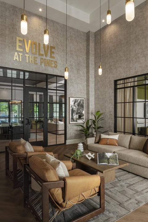A modern living room with a brown sofa and a coffee table.