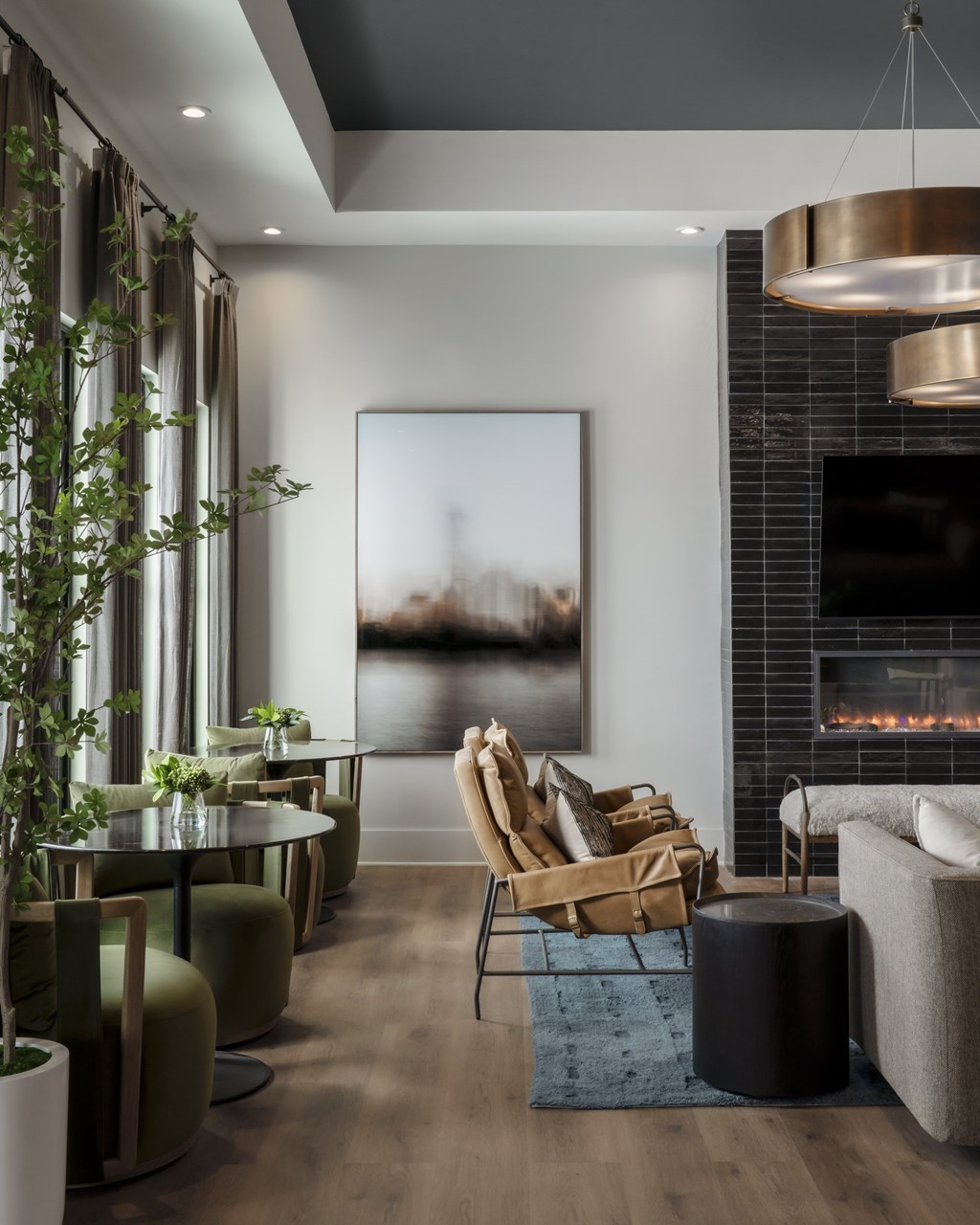 A modern living room with a fireplace and a large painting on the wall.