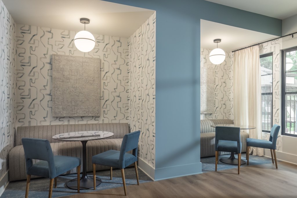 A room with a table and chairs in it.