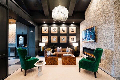 A living room with a green chair and a fireplace.