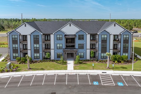 Exterior building with a parking lot in the front.